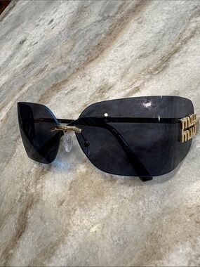 Black Rimless Shield Sunglasses with Gold Accents